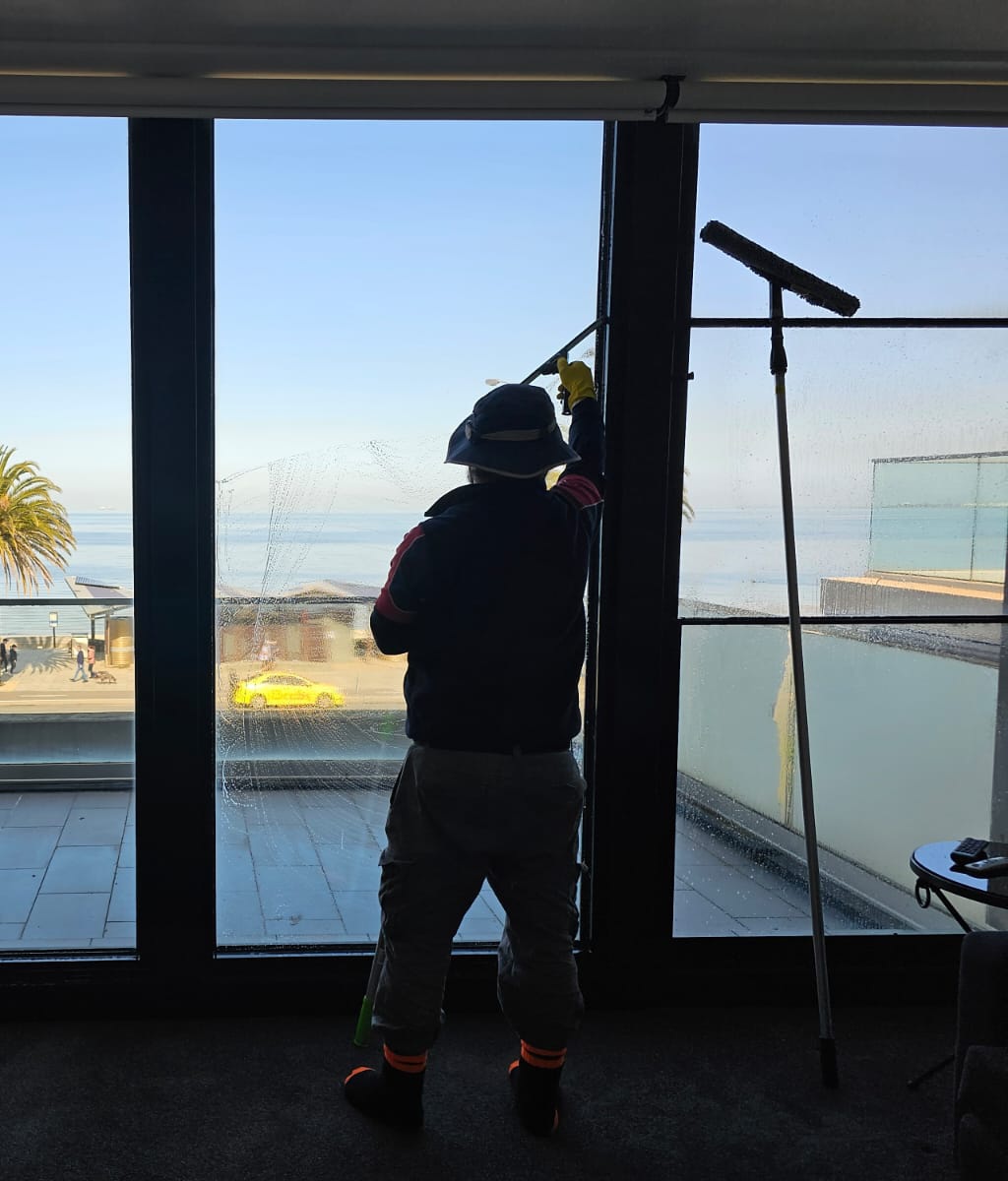 Professional window cleaner at work in Melbourne